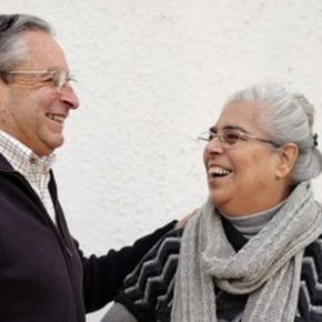 Old couple hugging and smiling